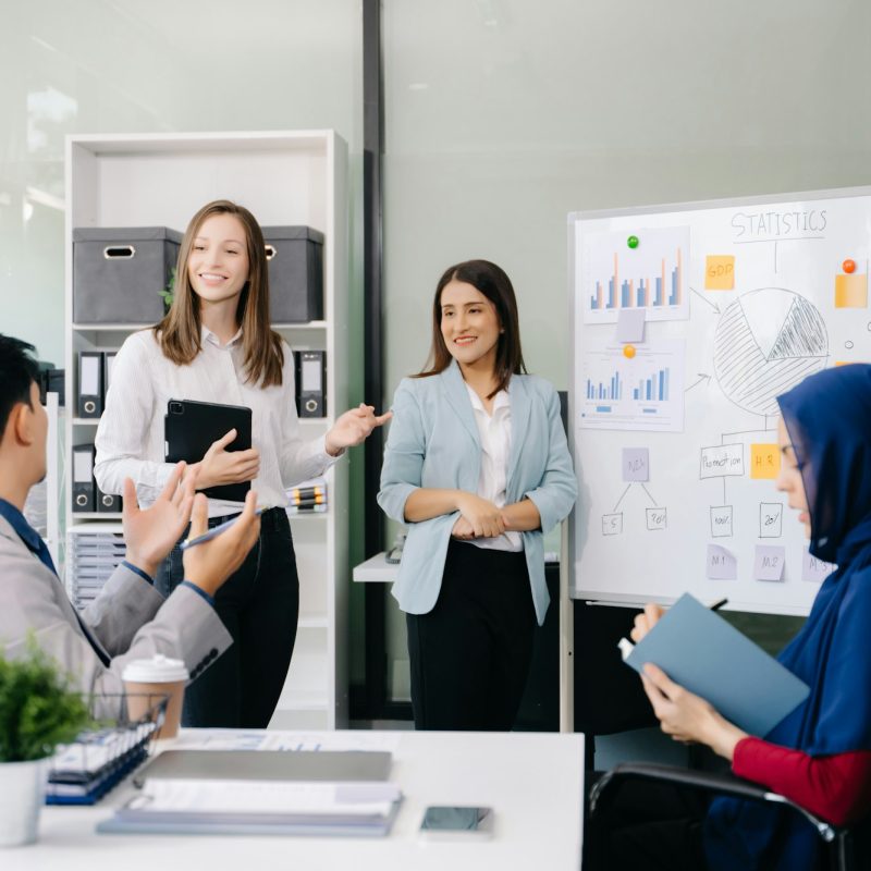 Creative business people working on business project in office